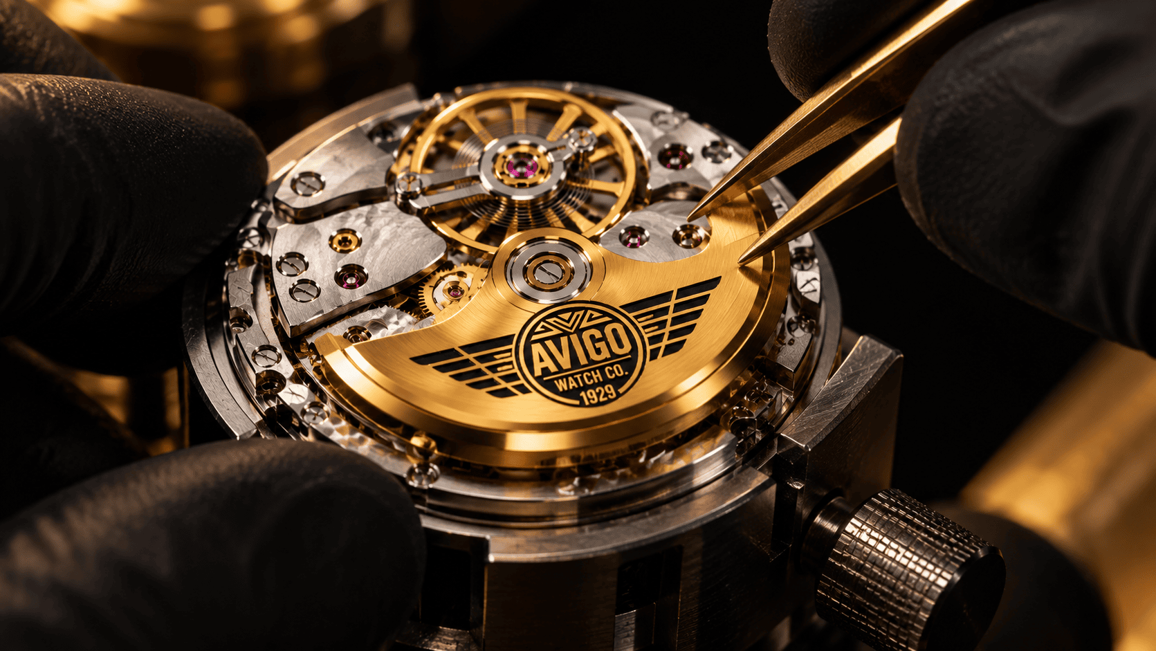 Close up of AVIGO watch movement with gold rotor and intricate gears 