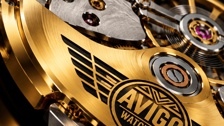 Close up of AVIGO luxury watch movement with gold and silver details 